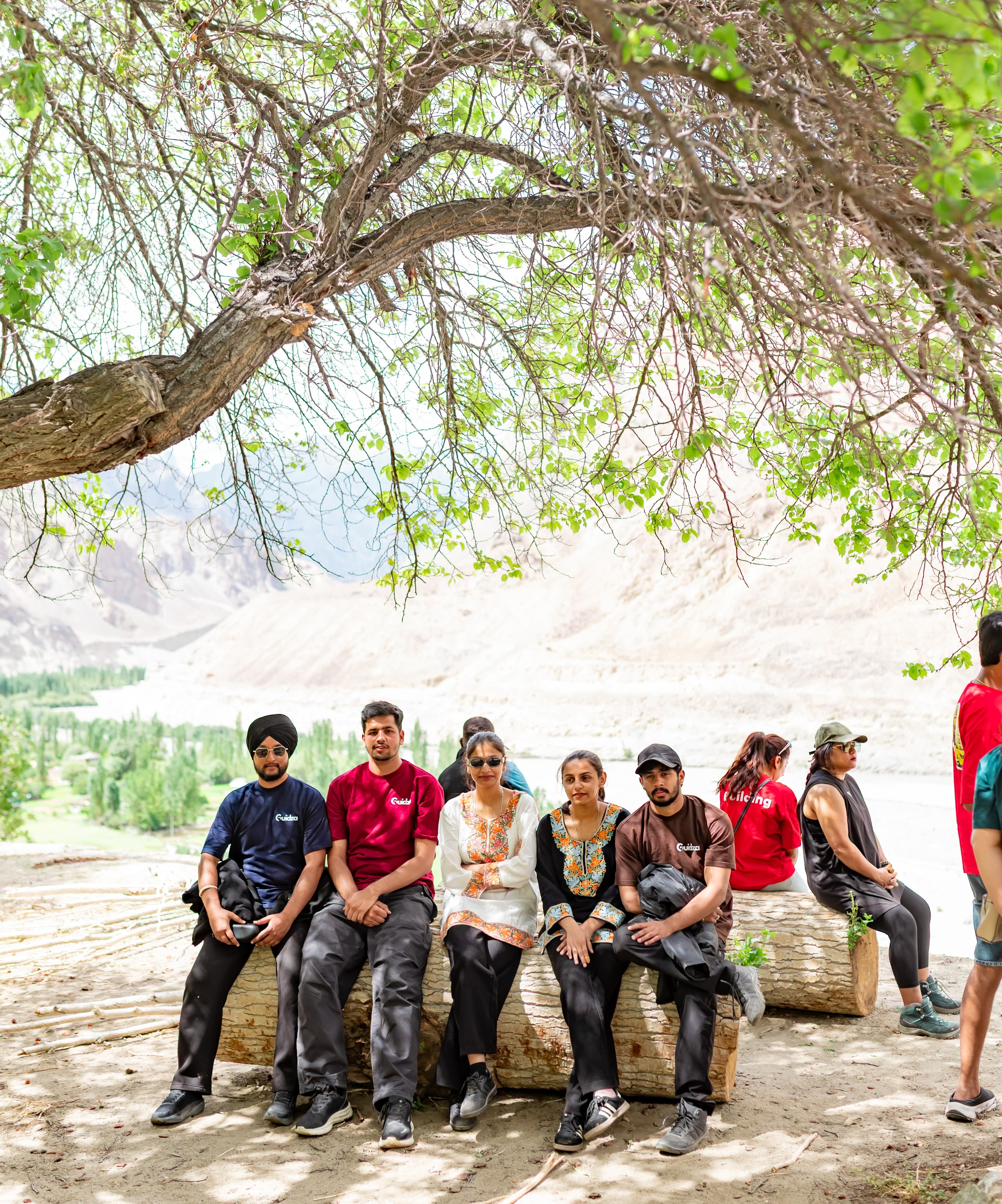 TGroup of travellers on a scenic trail during a curated Guidza adventure